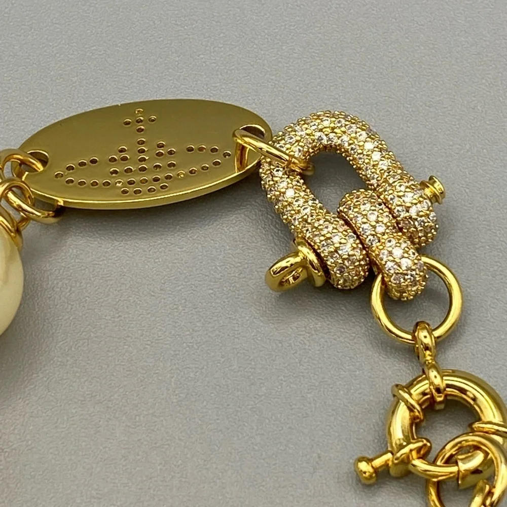 Vivienne Westwood large faux pearl bracelet with encrusted lock in gold tone